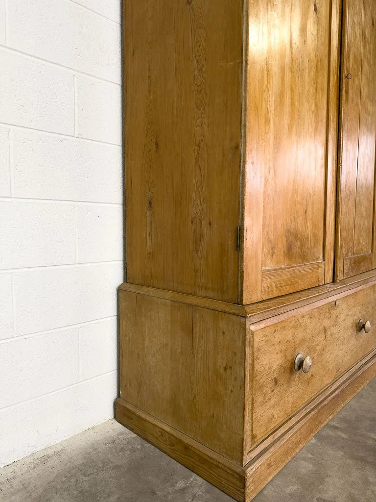 Antique English pine wardrobe or cupboard with a drawer