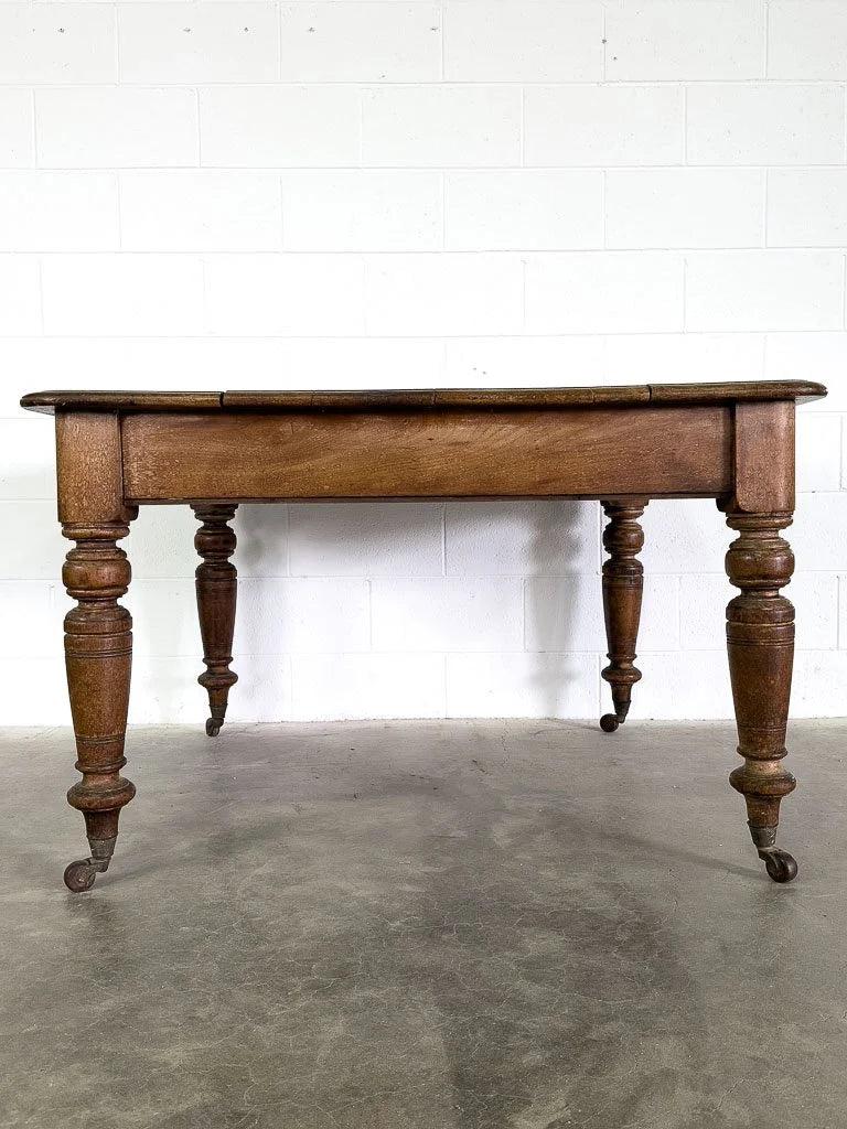 Square English breakfast table with turned legs and castors