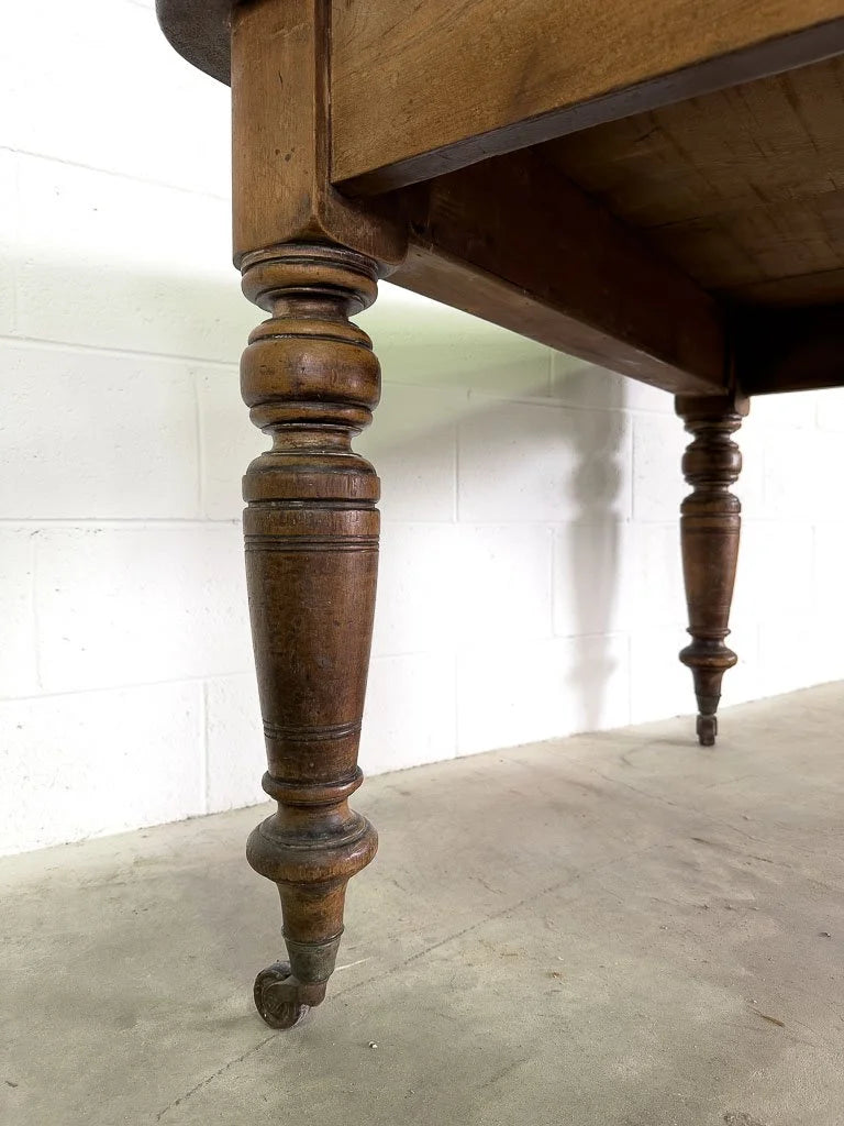 Square English breakfast table with turned legs and castors