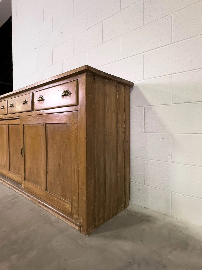 English pine sideboard with sliding doors and brass hardware
