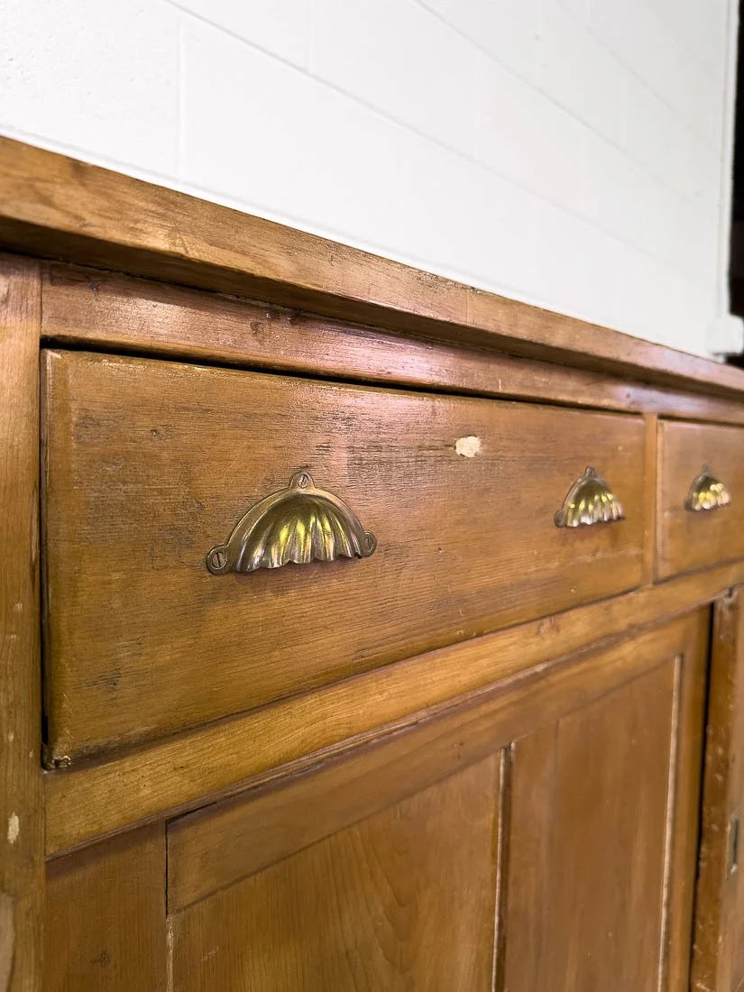 English pine sideboard with sliding doors and brass hardware