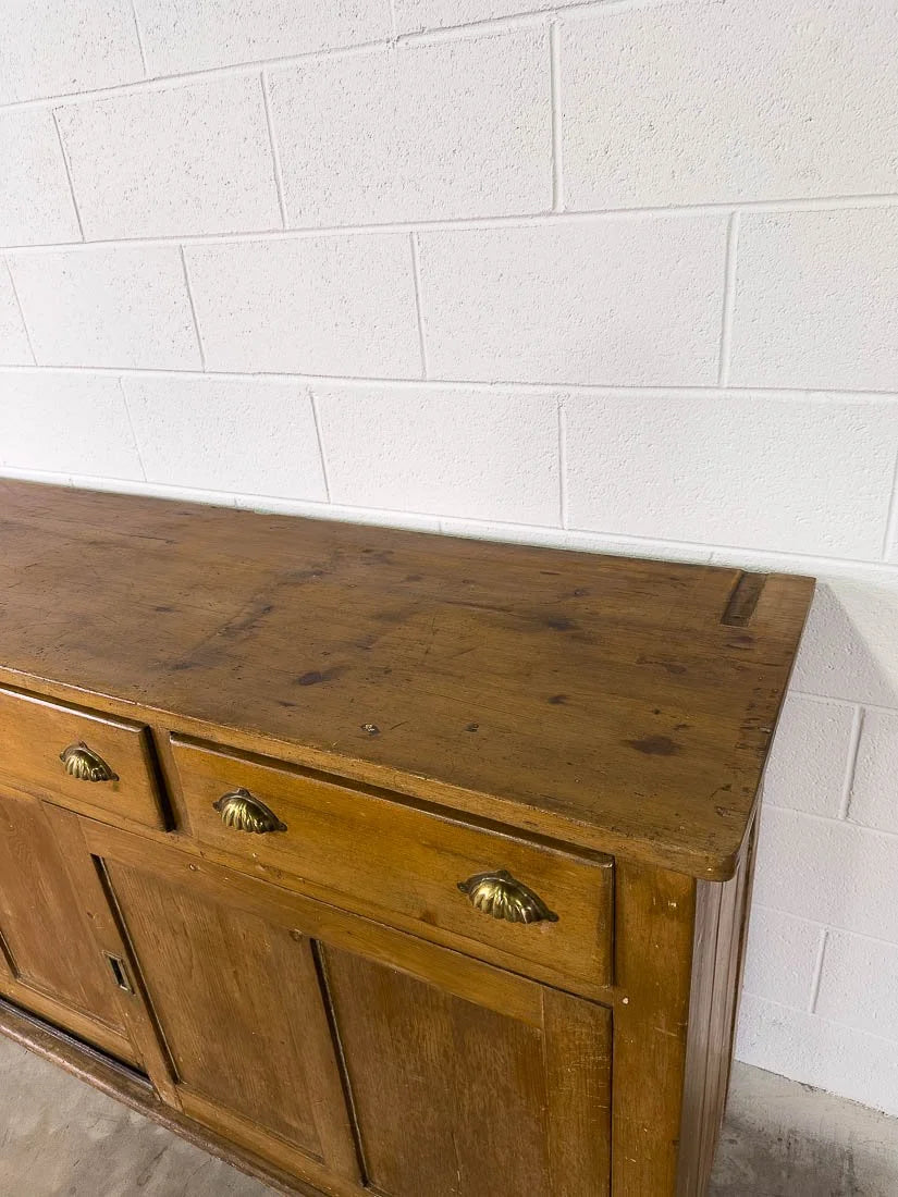 English pine sideboard with sliding doors and brass hardware