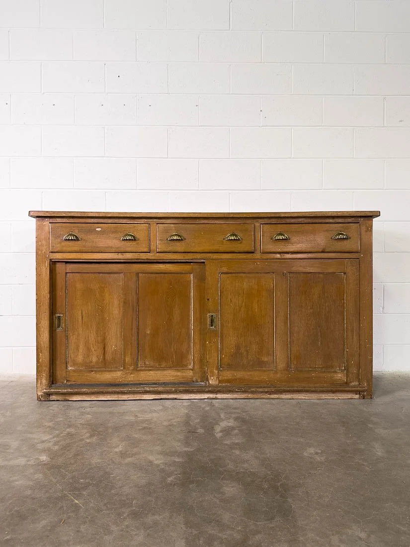English pine sideboard with sliding doors and brass hardware
