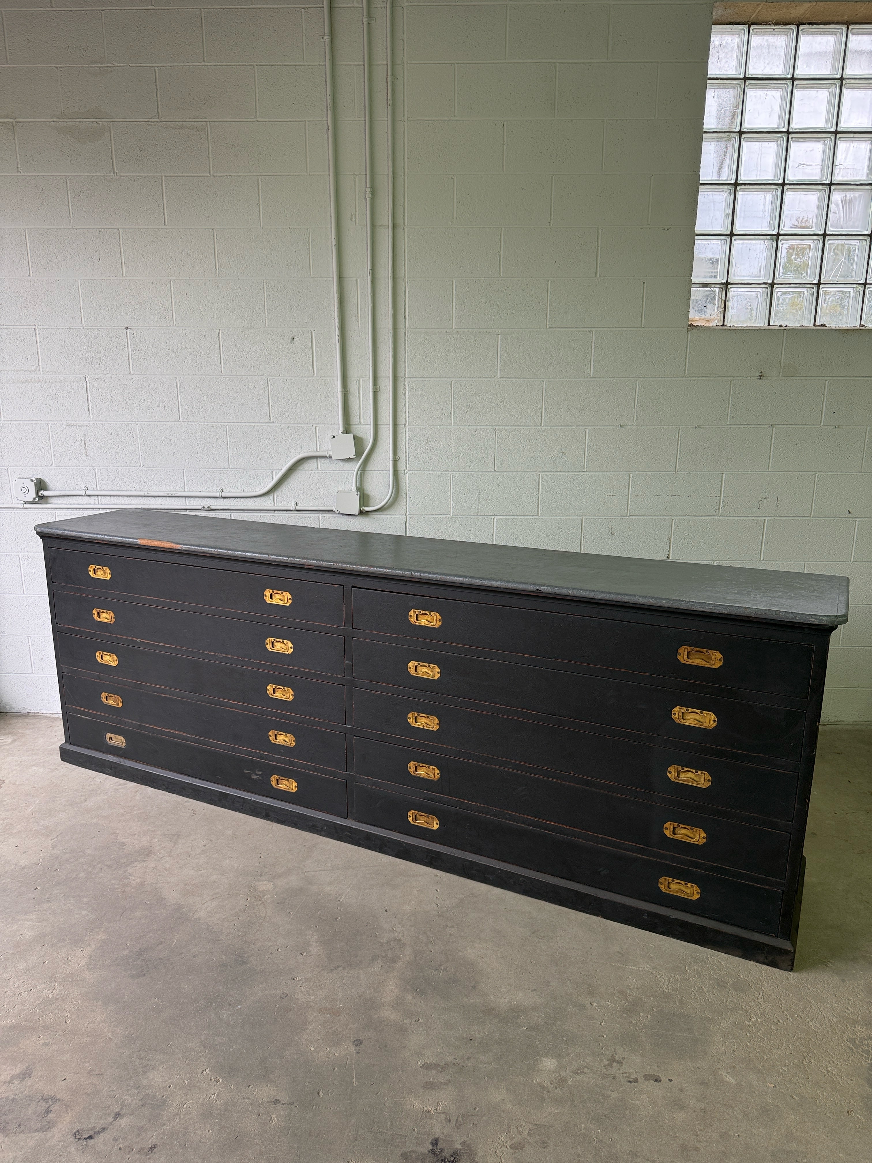 Monumental antique bank of 10 drawers with brass campaign handles
