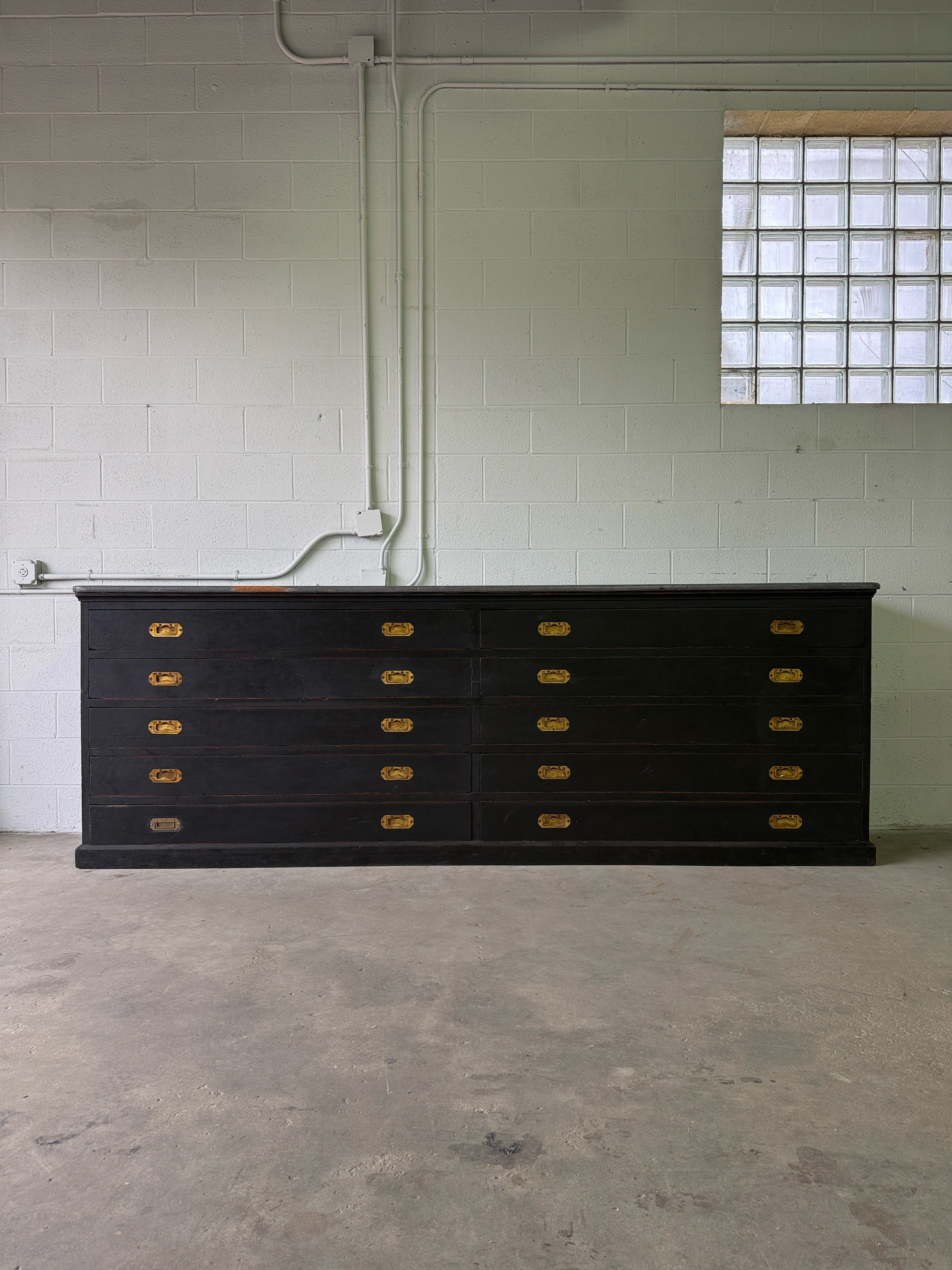 Monumental antique bank of 10 drawers with brass campaign handles