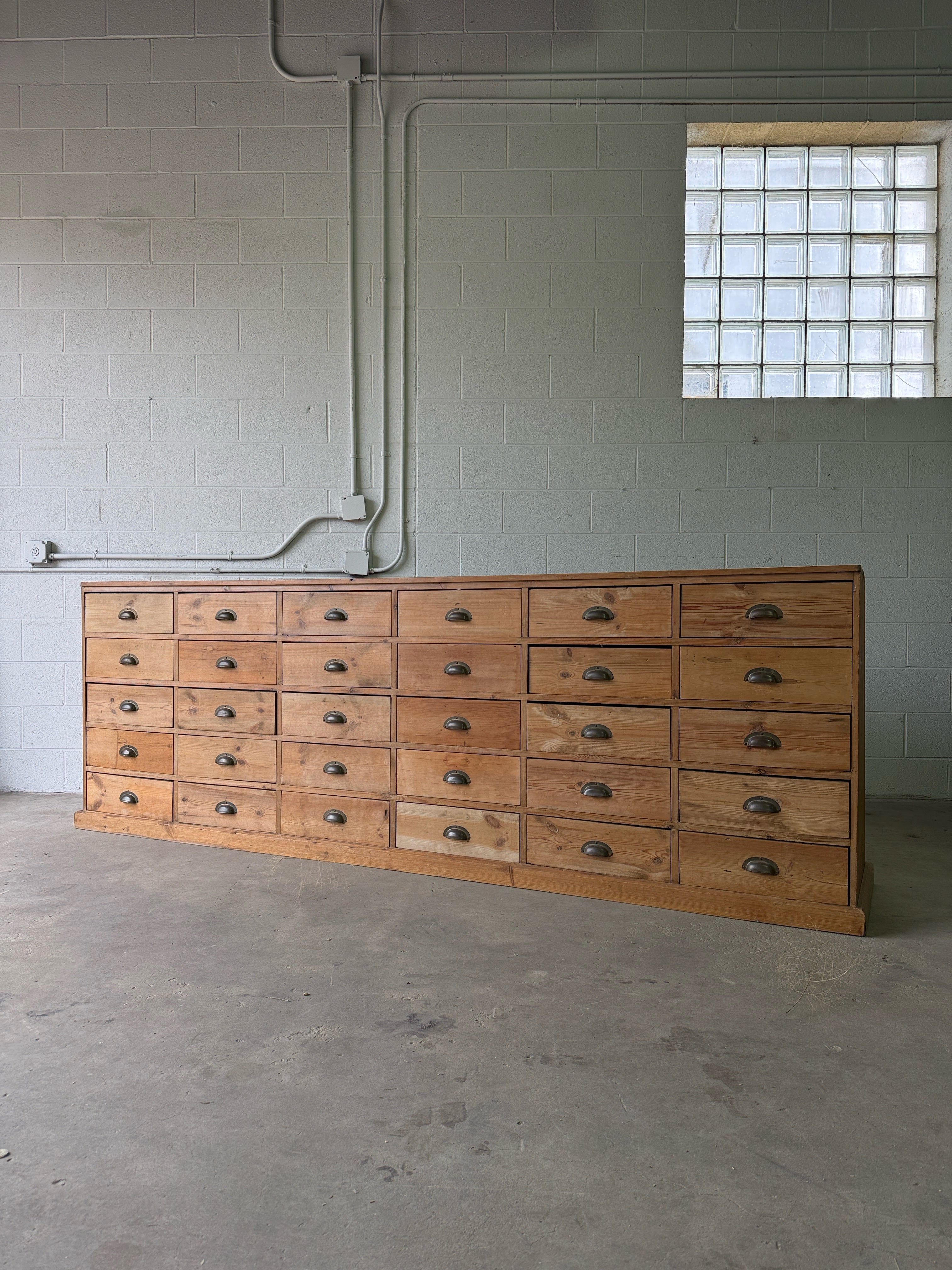 Antique European bank of haberdashery drawers