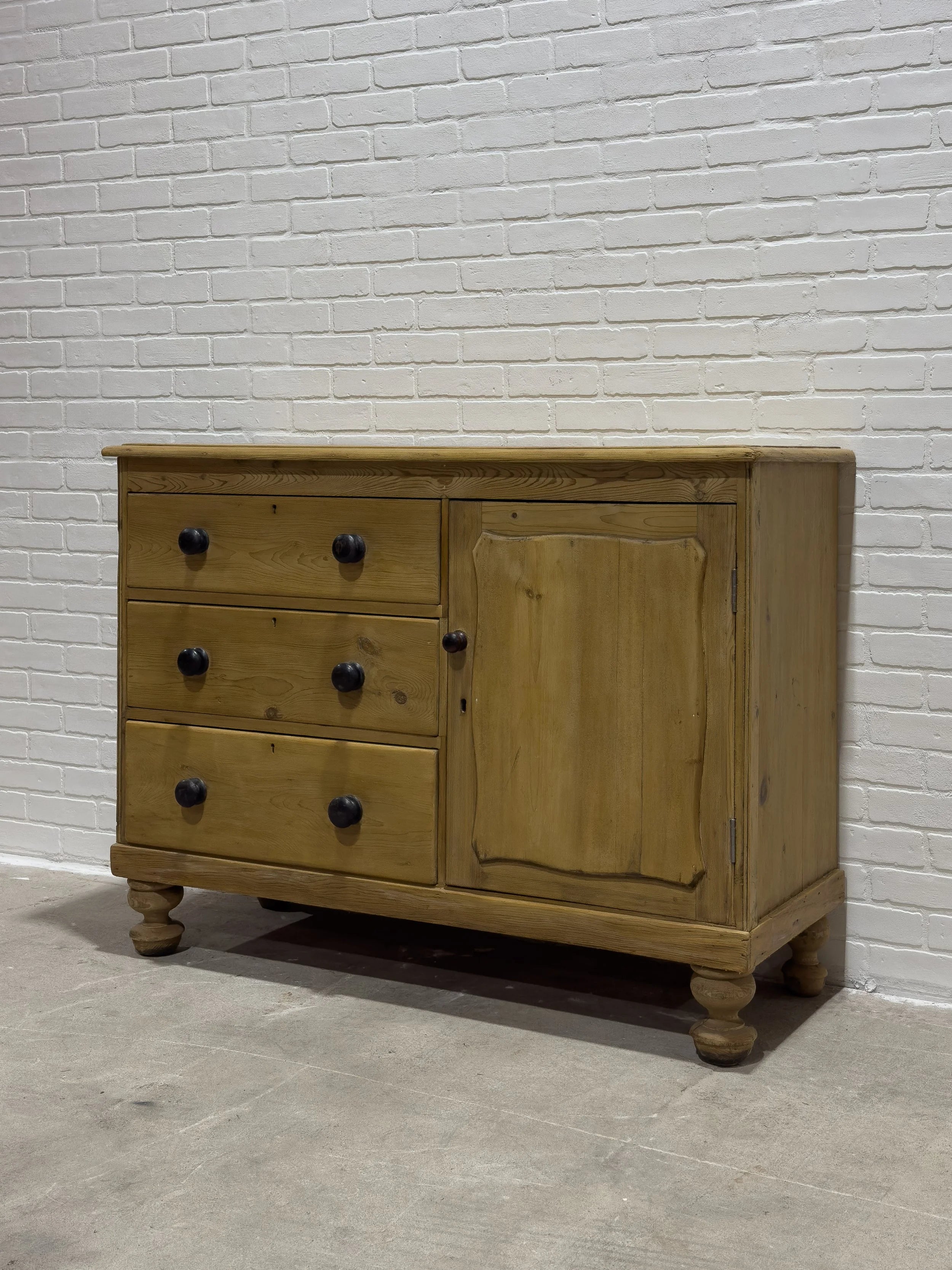 Victorian pine sideboard with dark knobs