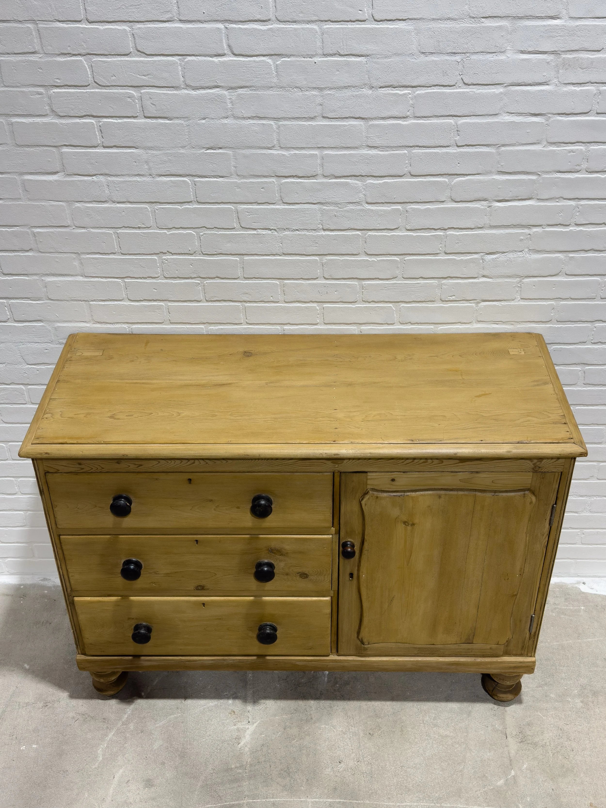 Victorian pine sideboard with dark knobs