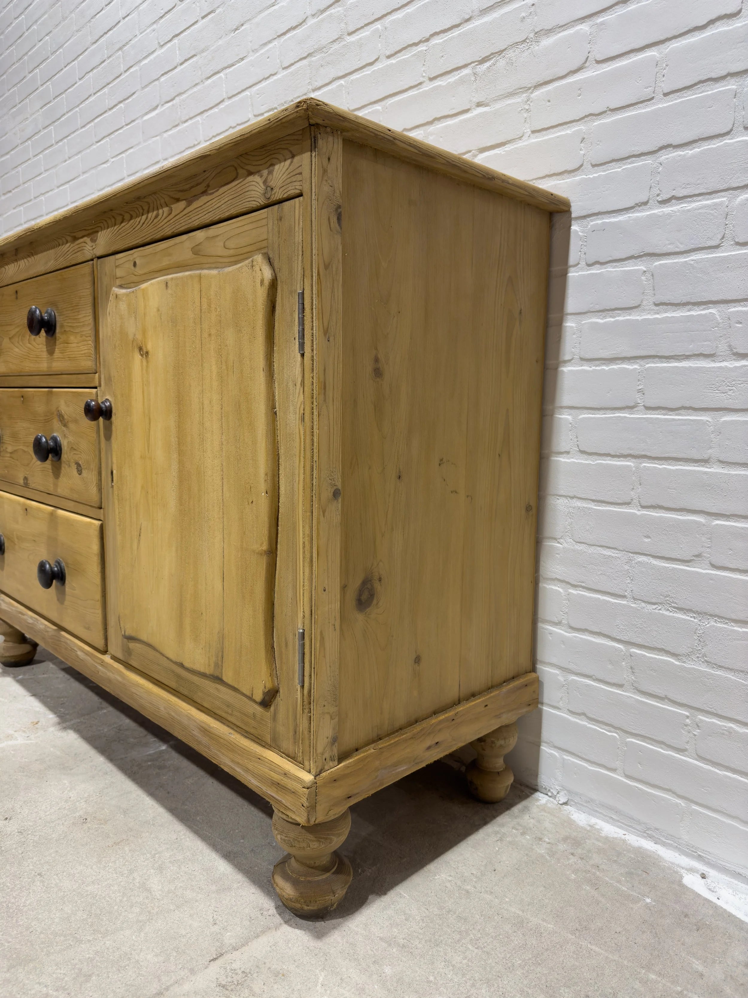 Victorian pine sideboard with dark knobs