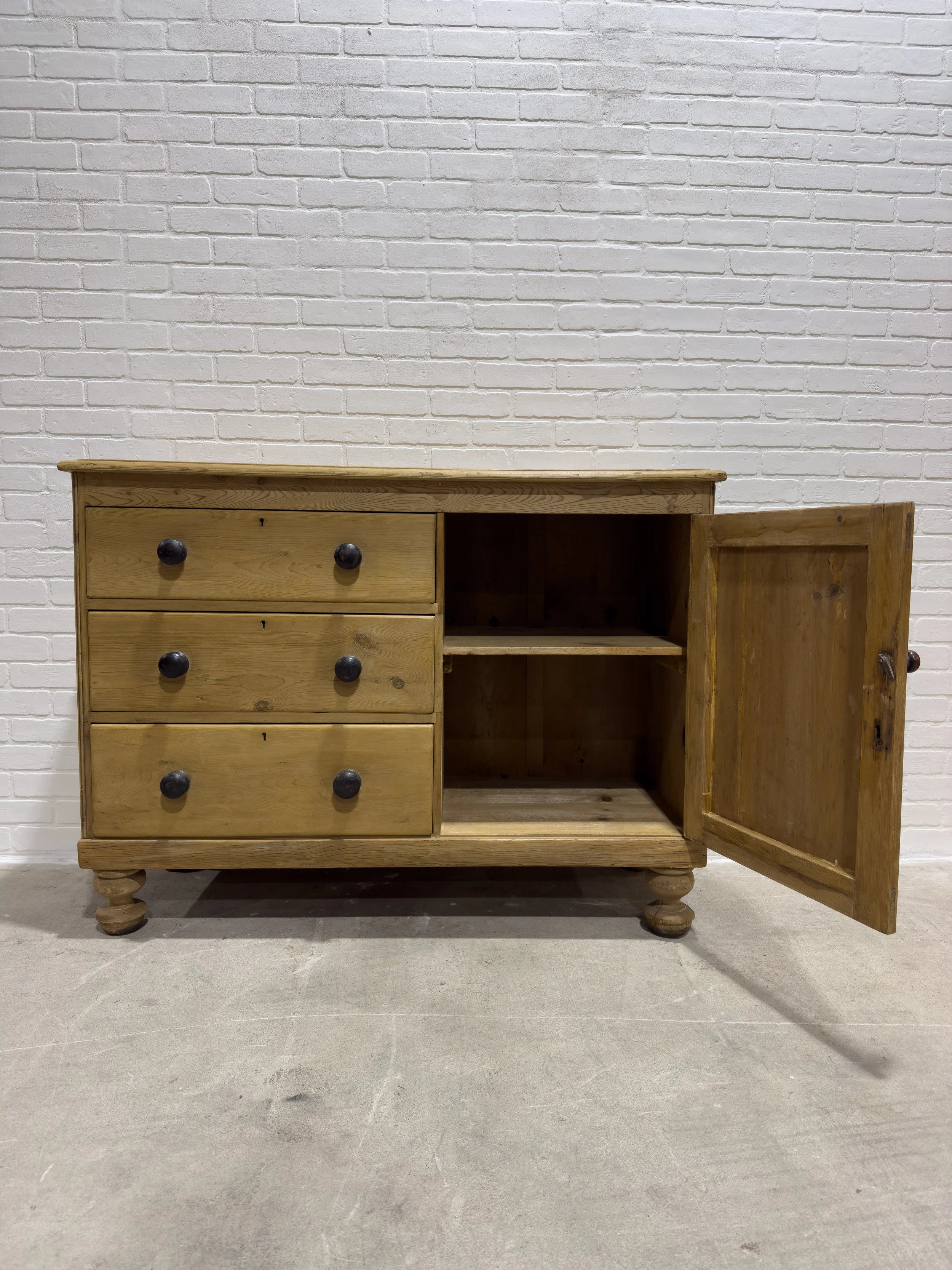 Victorian pine sideboard with dark knobs