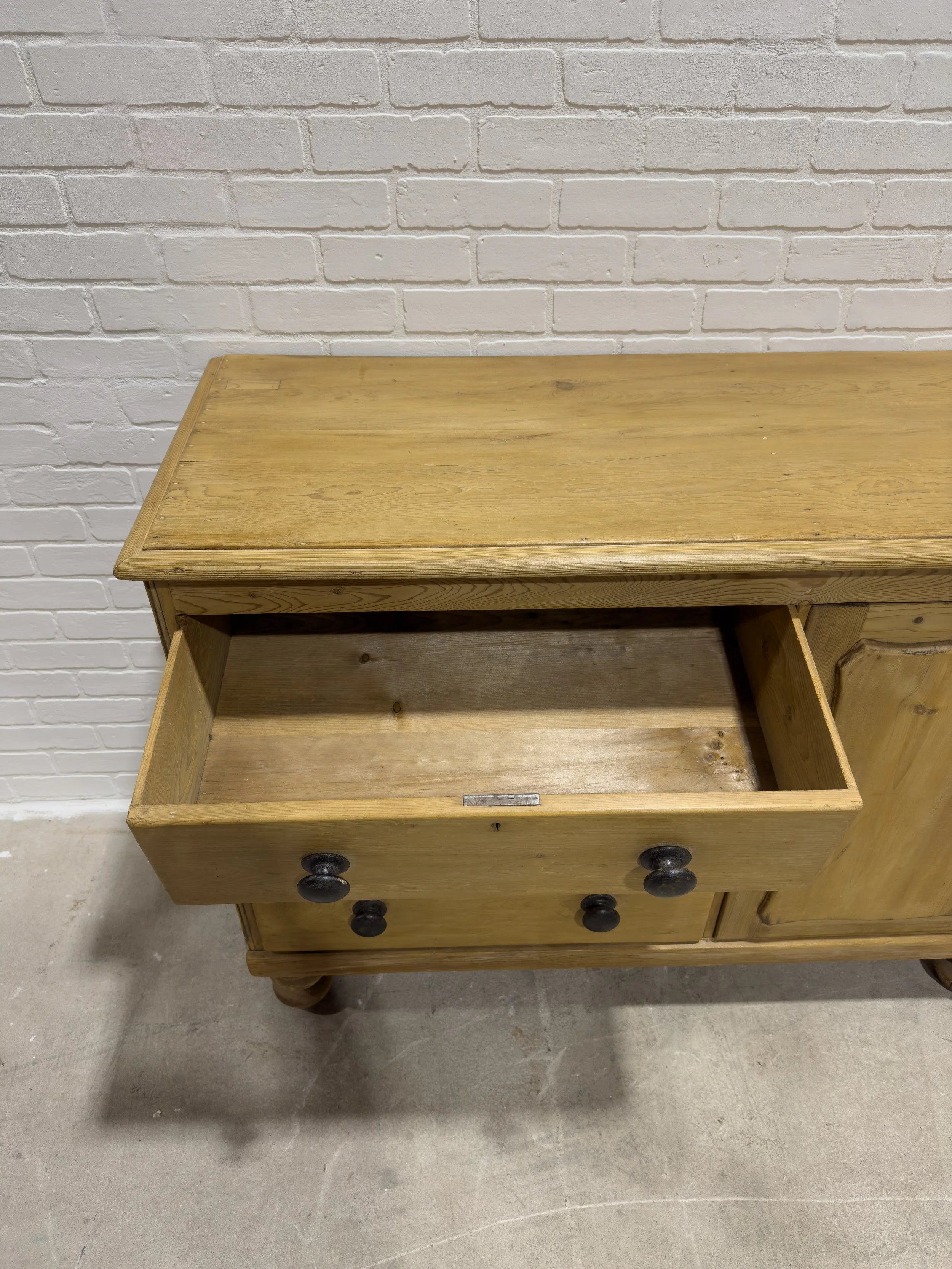 Victorian pine sideboard with dark knobs