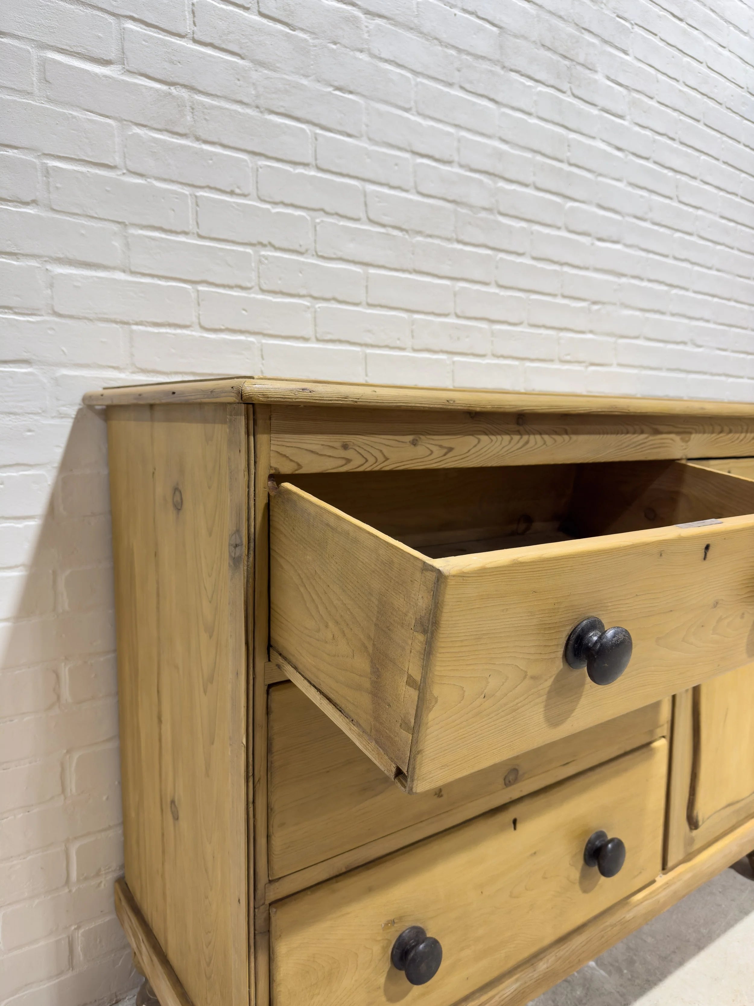 Victorian pine sideboard with dark knobs