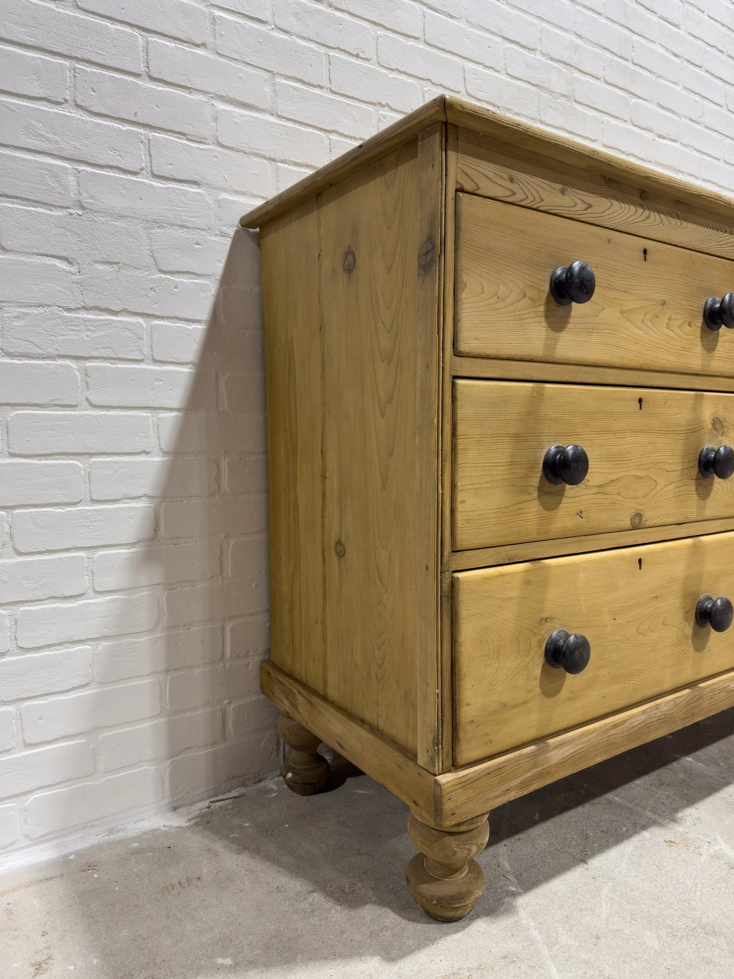 Victorian pine sideboard with dark knobs