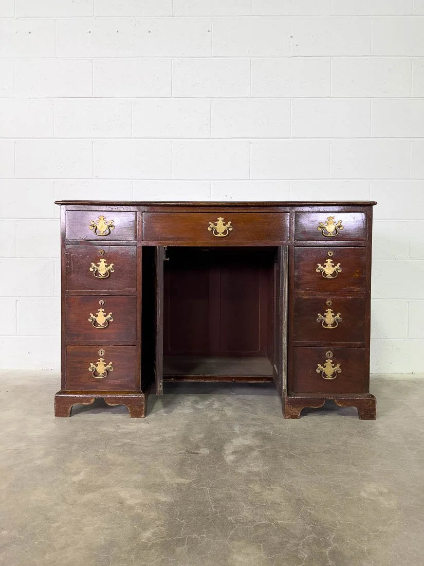 Antique English mahogany desk with cupboard below