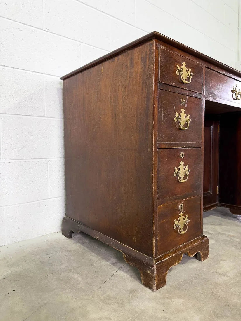 Antique English mahogany desk with cupboard below