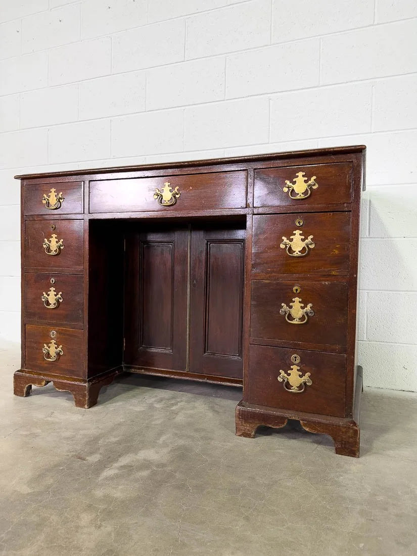 Antique English mahogany desk with cupboard below