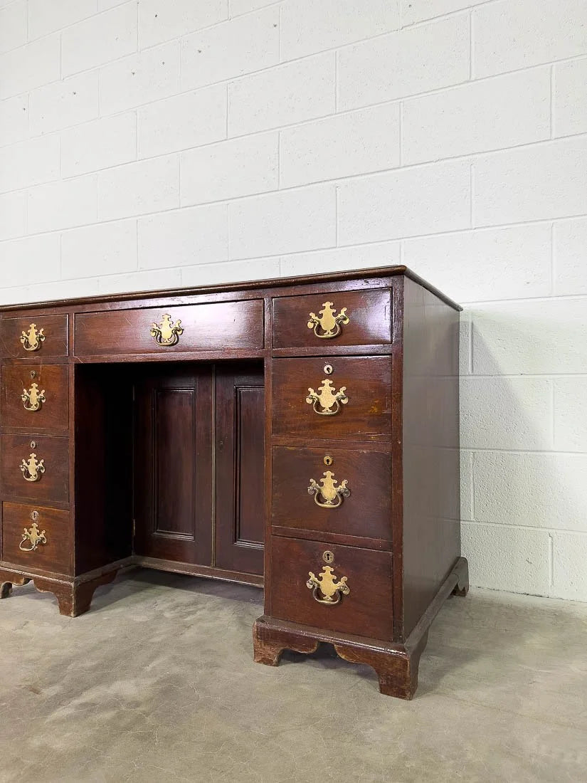 Antique English mahogany desk with cupboard below