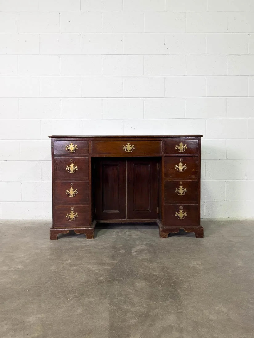 Antique English mahogany desk with cupboard below