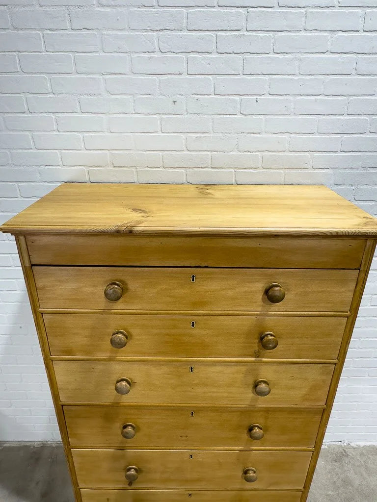 Tall antique pine chest of drawers
