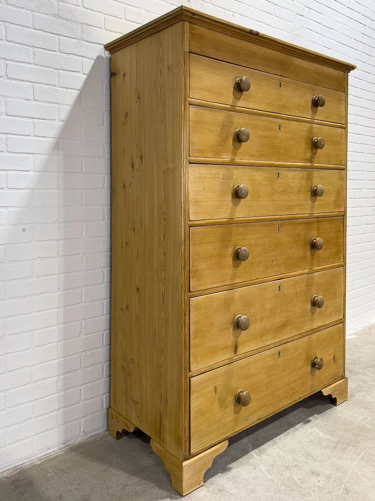 Tall antique pine chest of drawers