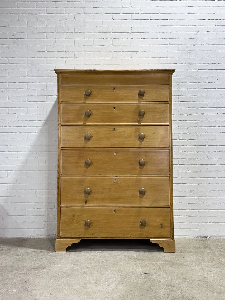 Tall antique pine chest of drawers