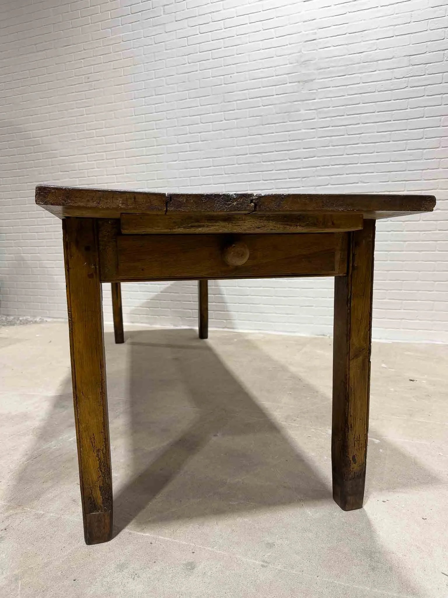 Wonderful eight foot French table with a drawer
