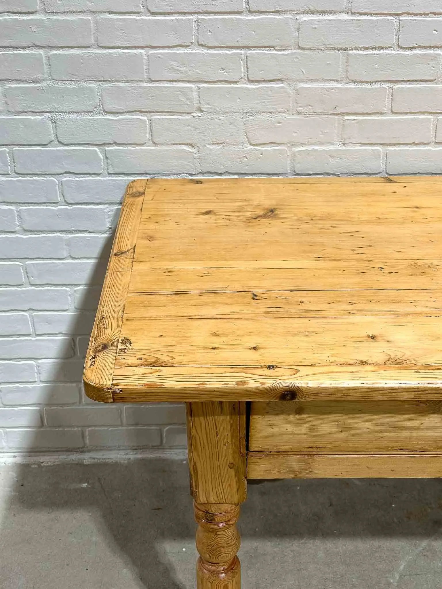 Antique English dining table with two drawers