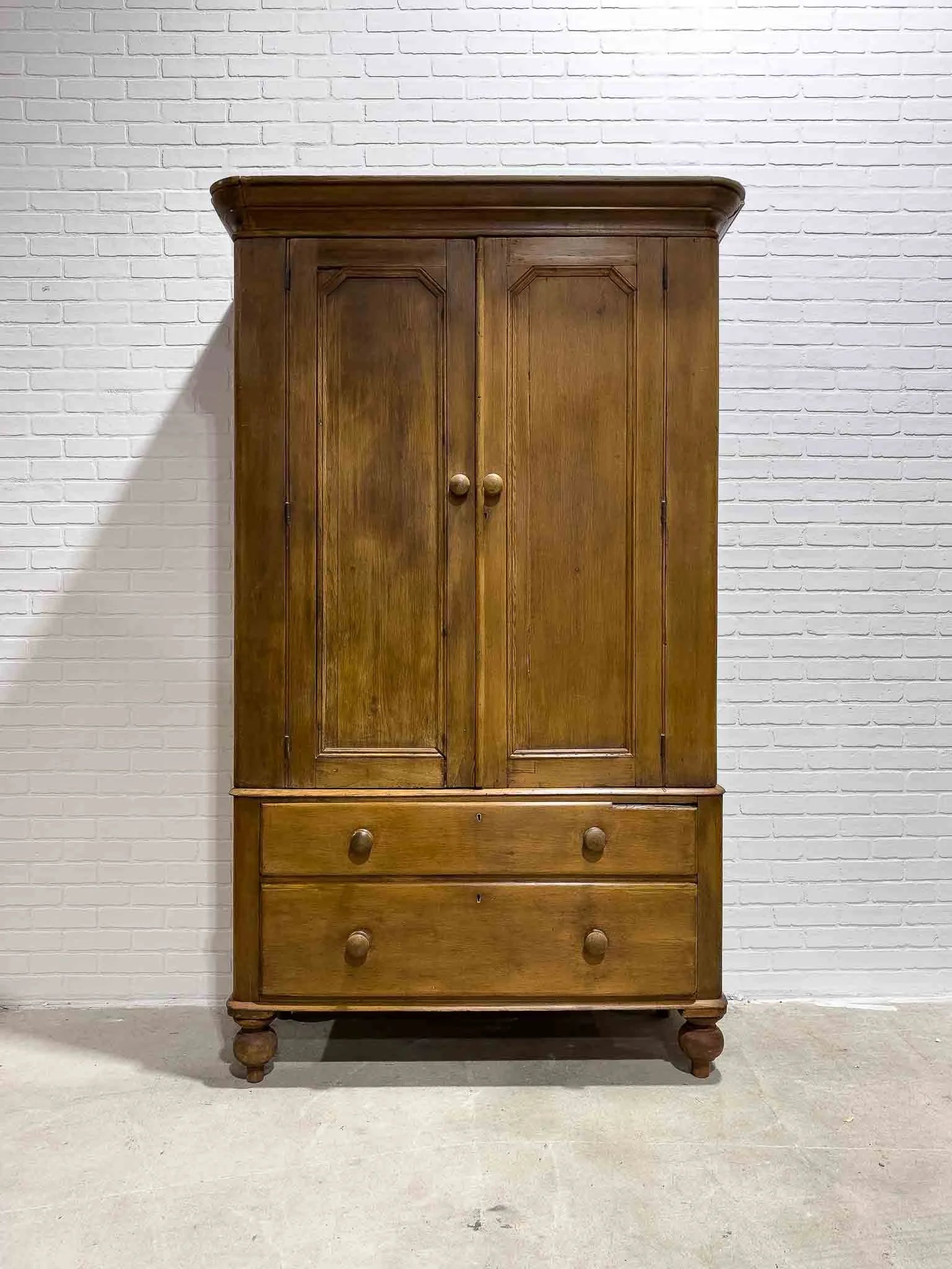 Antique pine wardrobe on tulip feet
