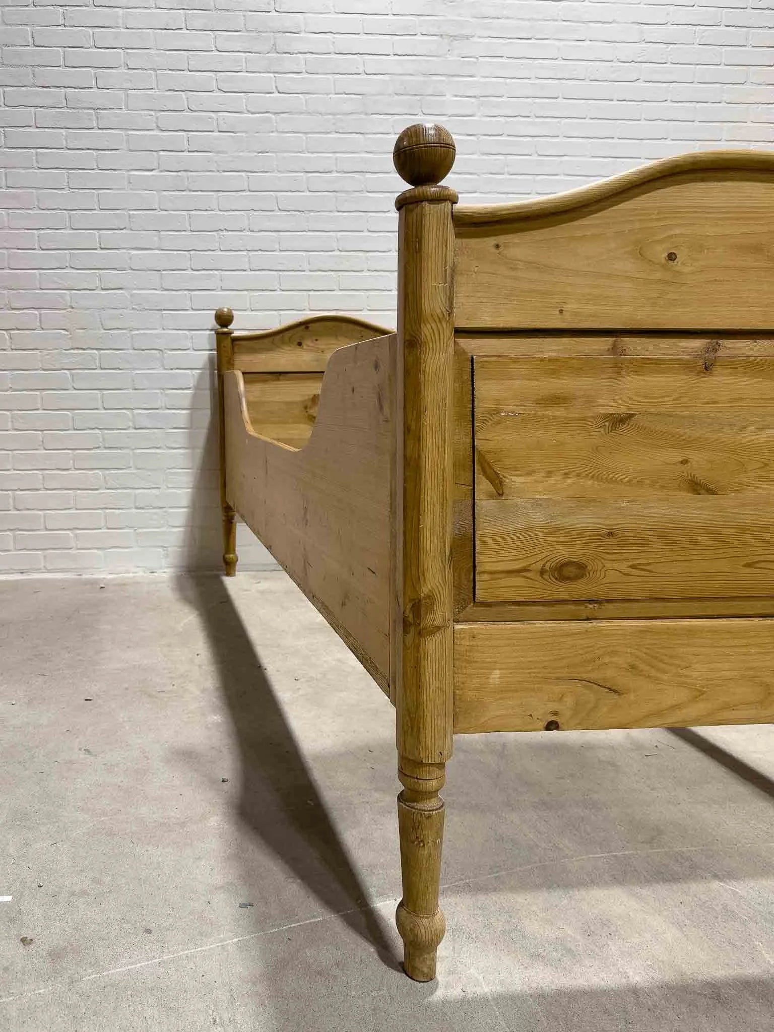 Narrow English pine sleigh bed