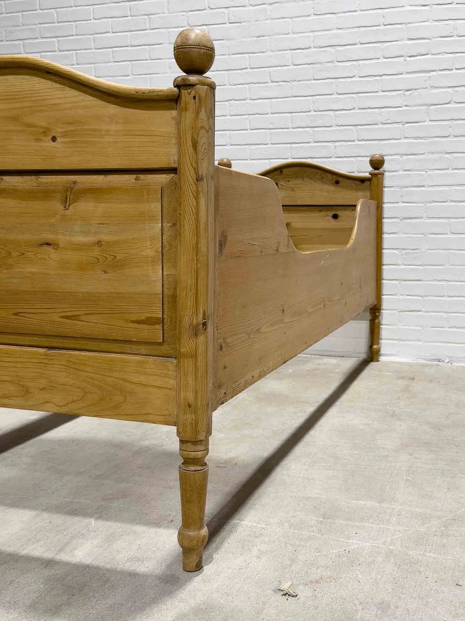 Narrow English pine sleigh bed