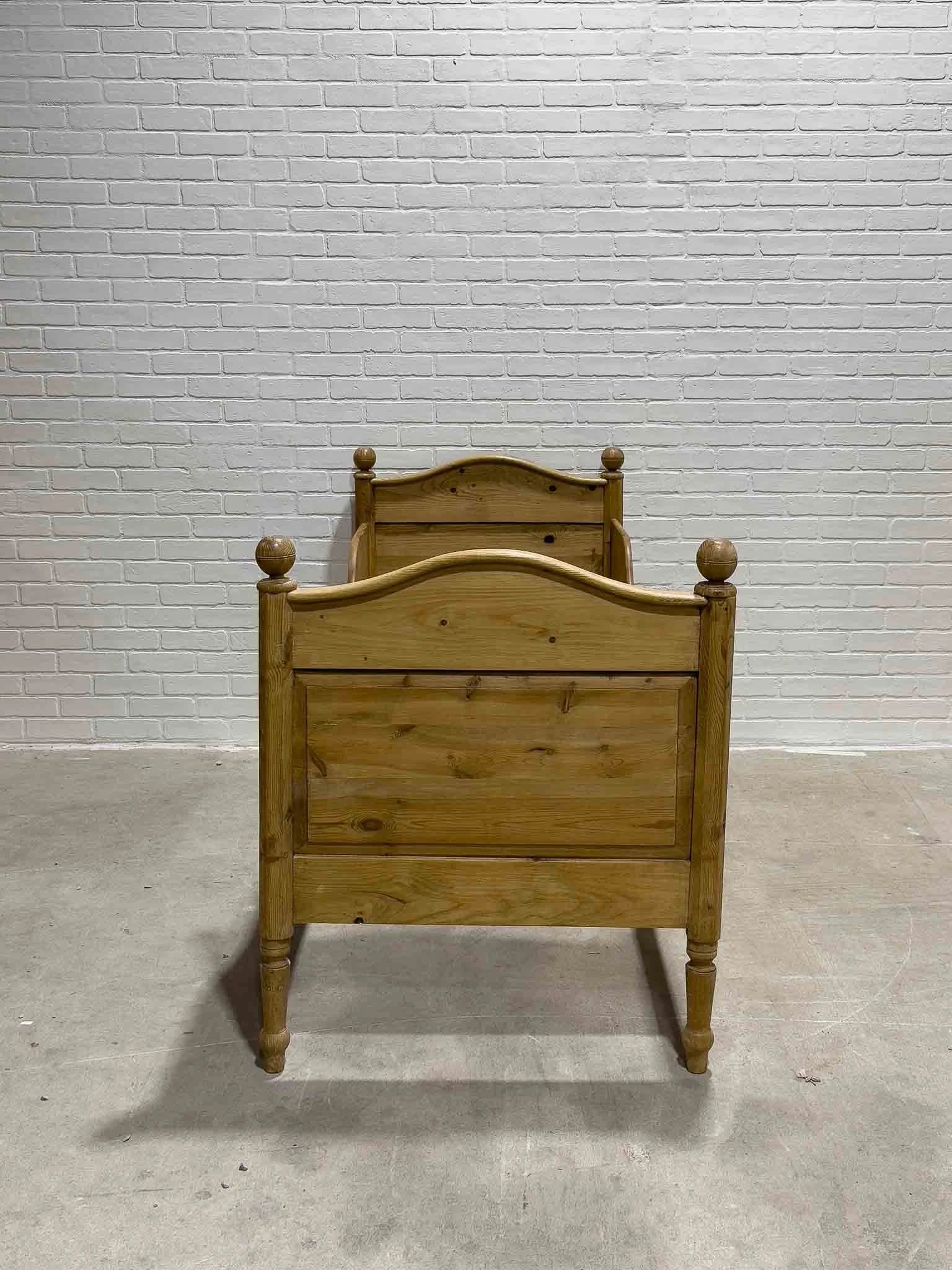 Narrow English pine sleigh bed