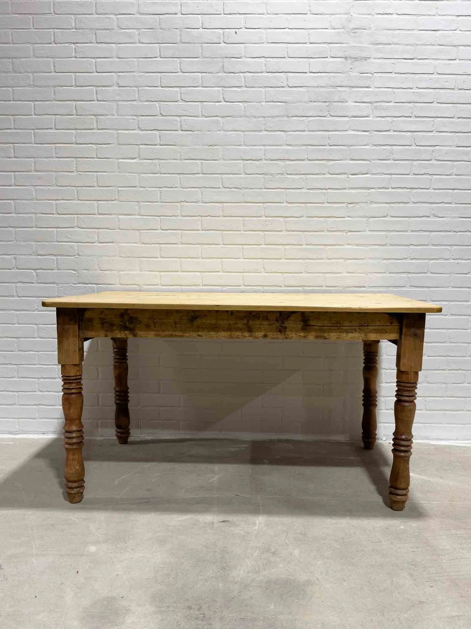 Antique pine kitchen table with a plank top