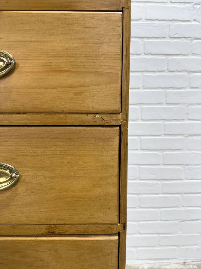 Antique English pine dresser with oval brasses
