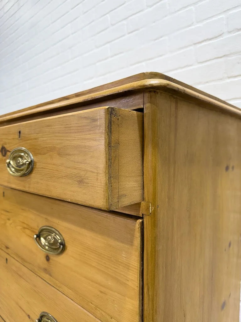Antique English pine dresser with oval brasses