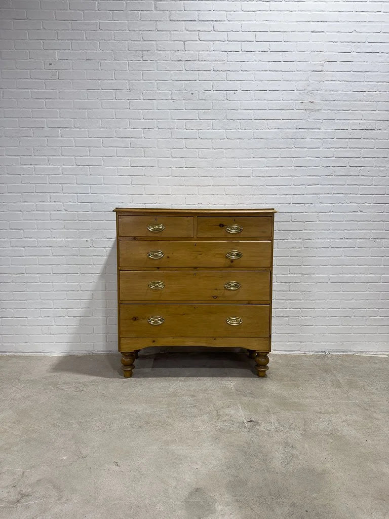 Antique English pine dresser with oval brasses