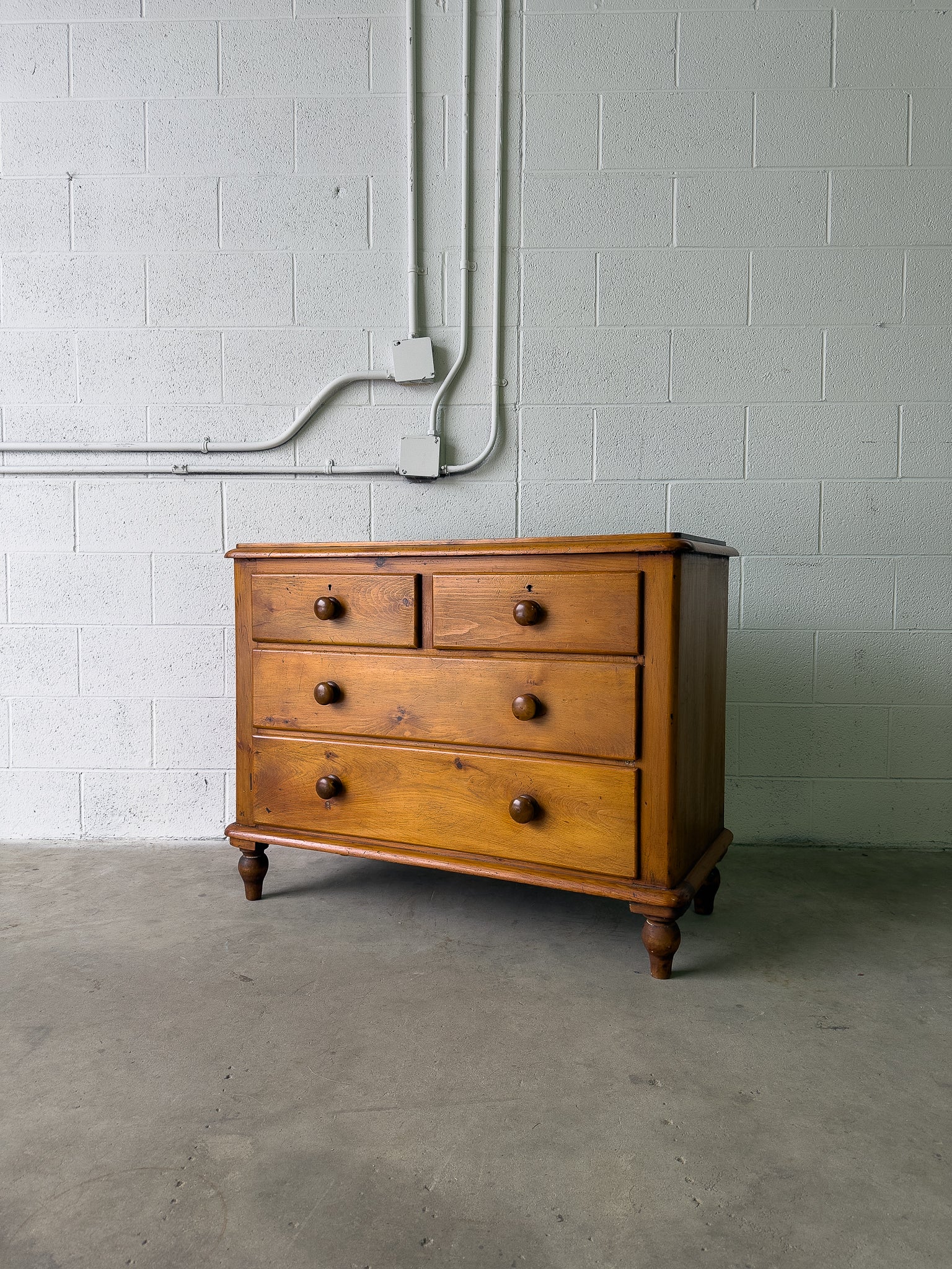 Antique pine chest of drawers on turned feet