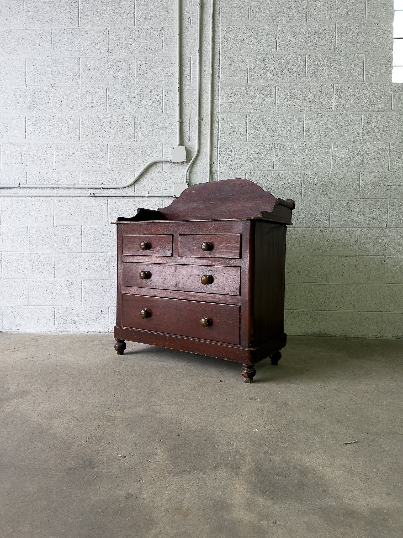 Stained antique pine chest of drawers