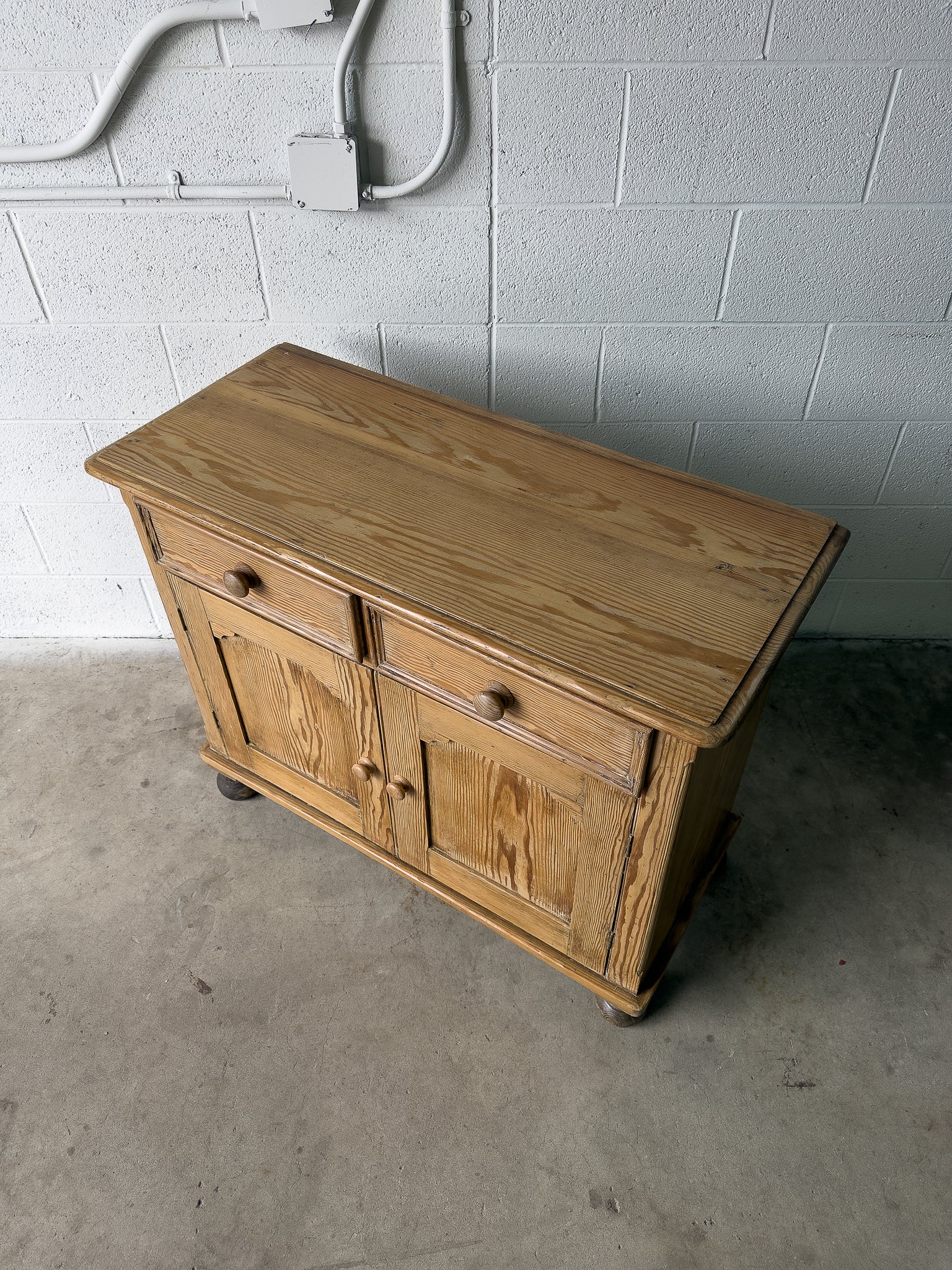 Petite antique pine sideboard with two doors