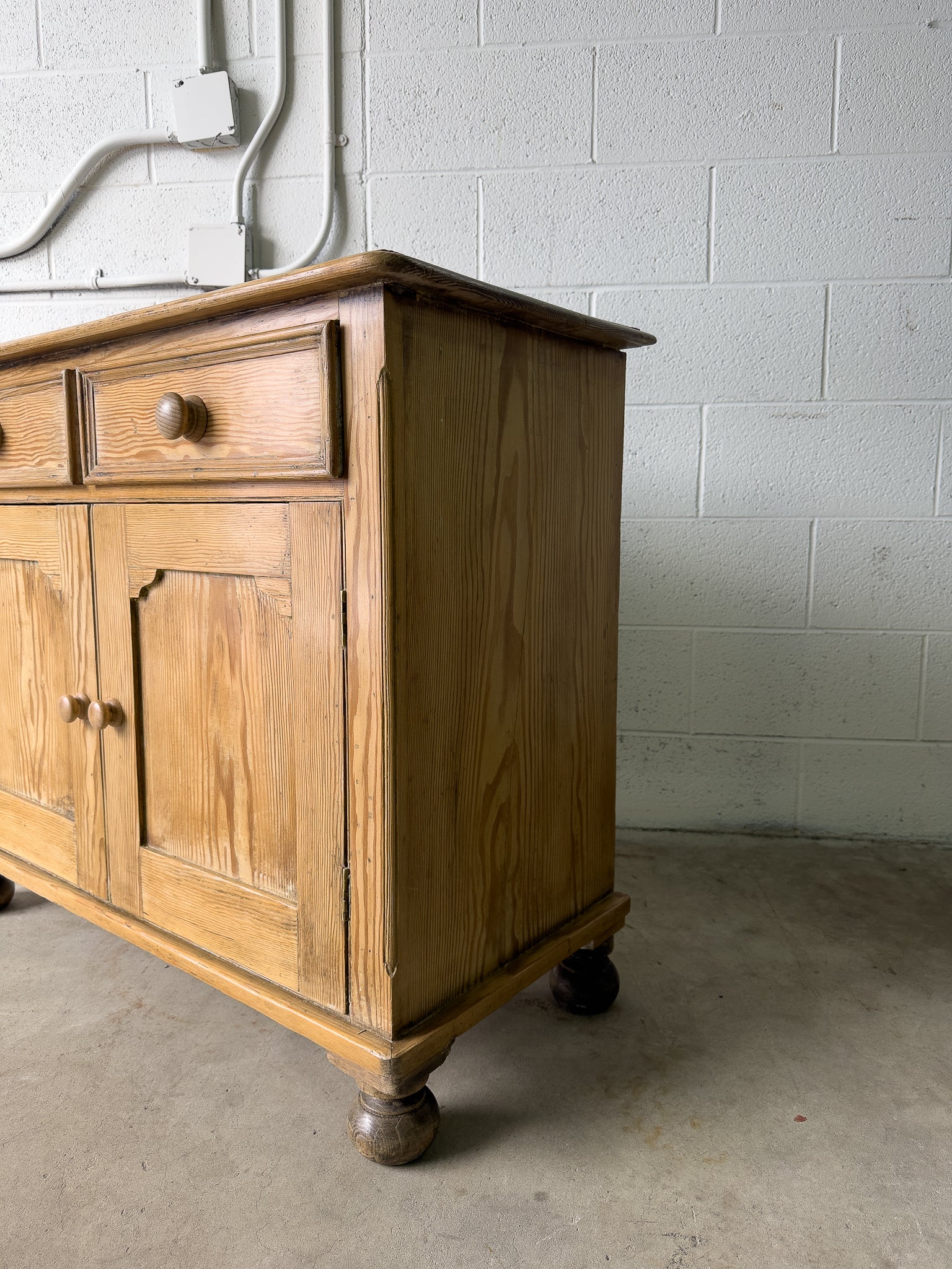 Petite antique pine sideboard with two doors