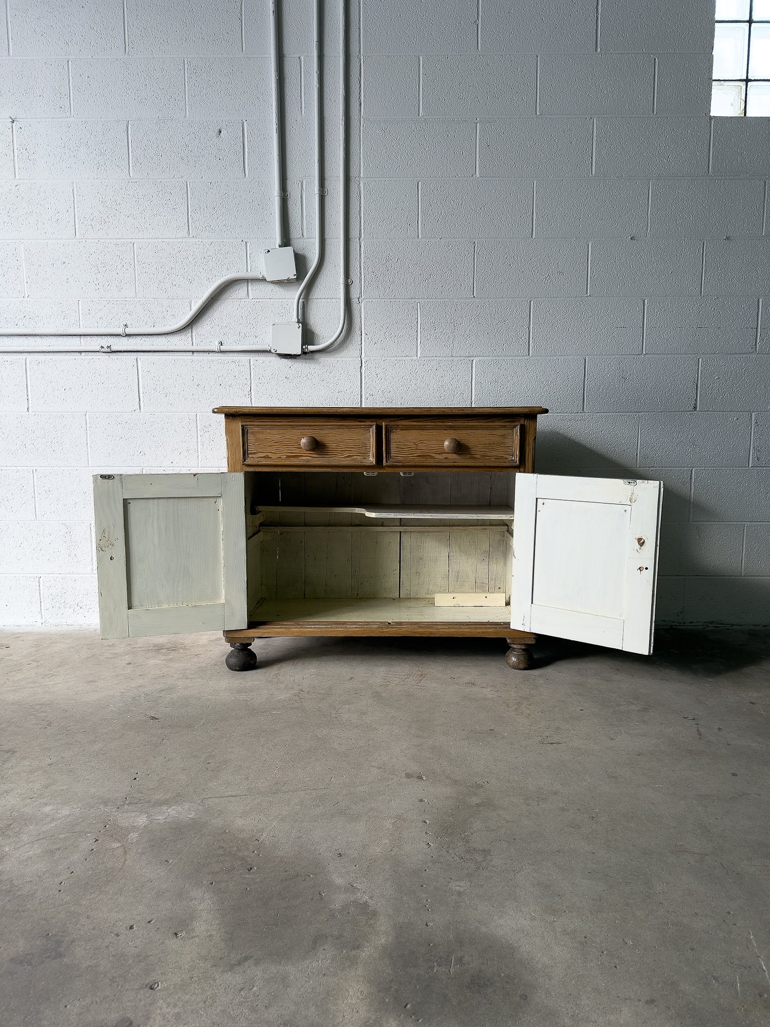 Petite antique pine sideboard with two doors