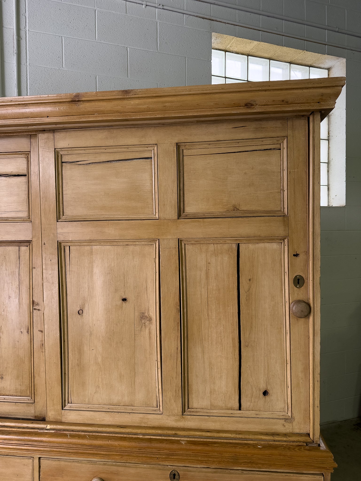 Large antique pine housekeepers cupboard with sliding doors