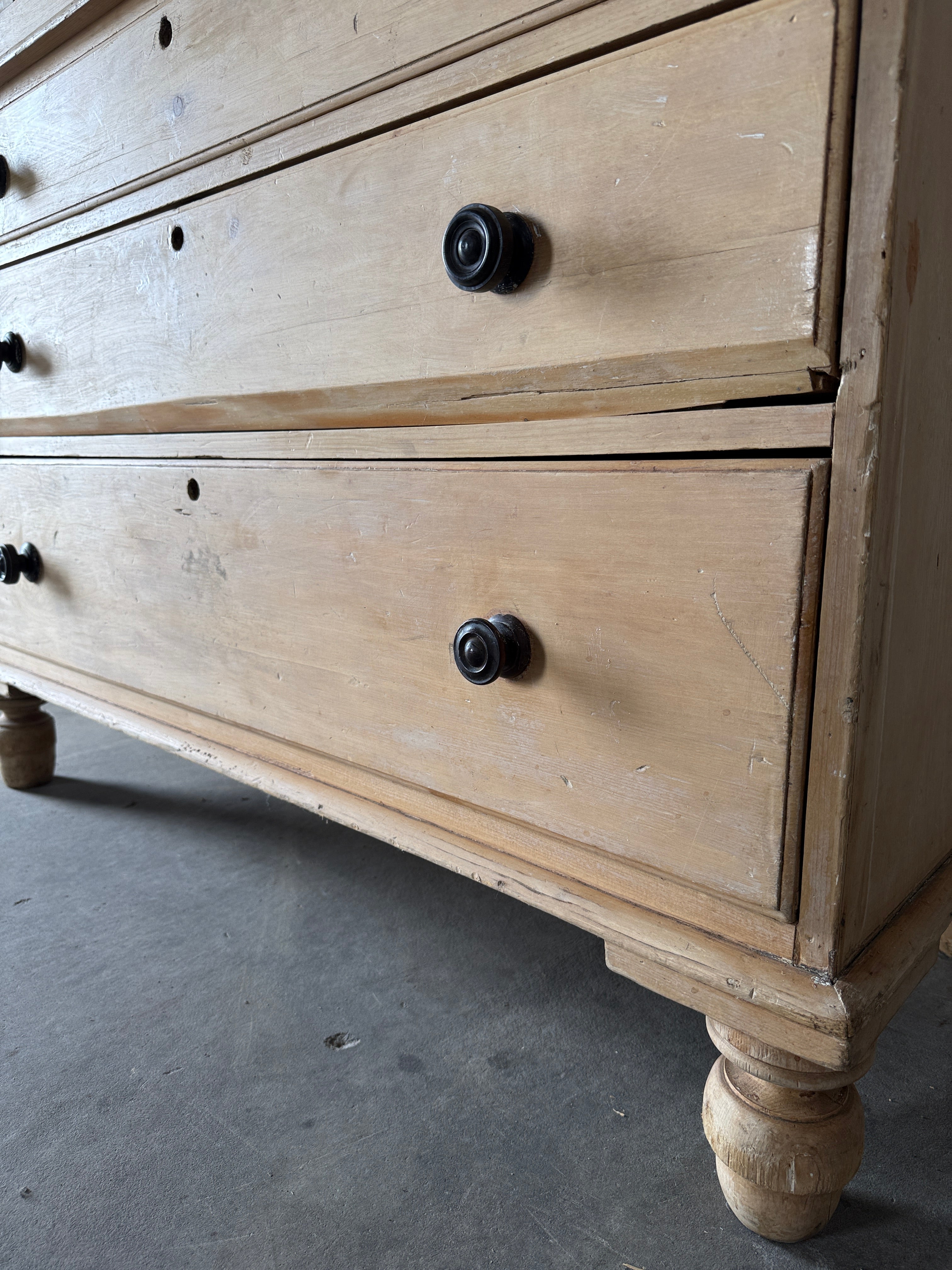 Antique English pine linen press with paneled doors