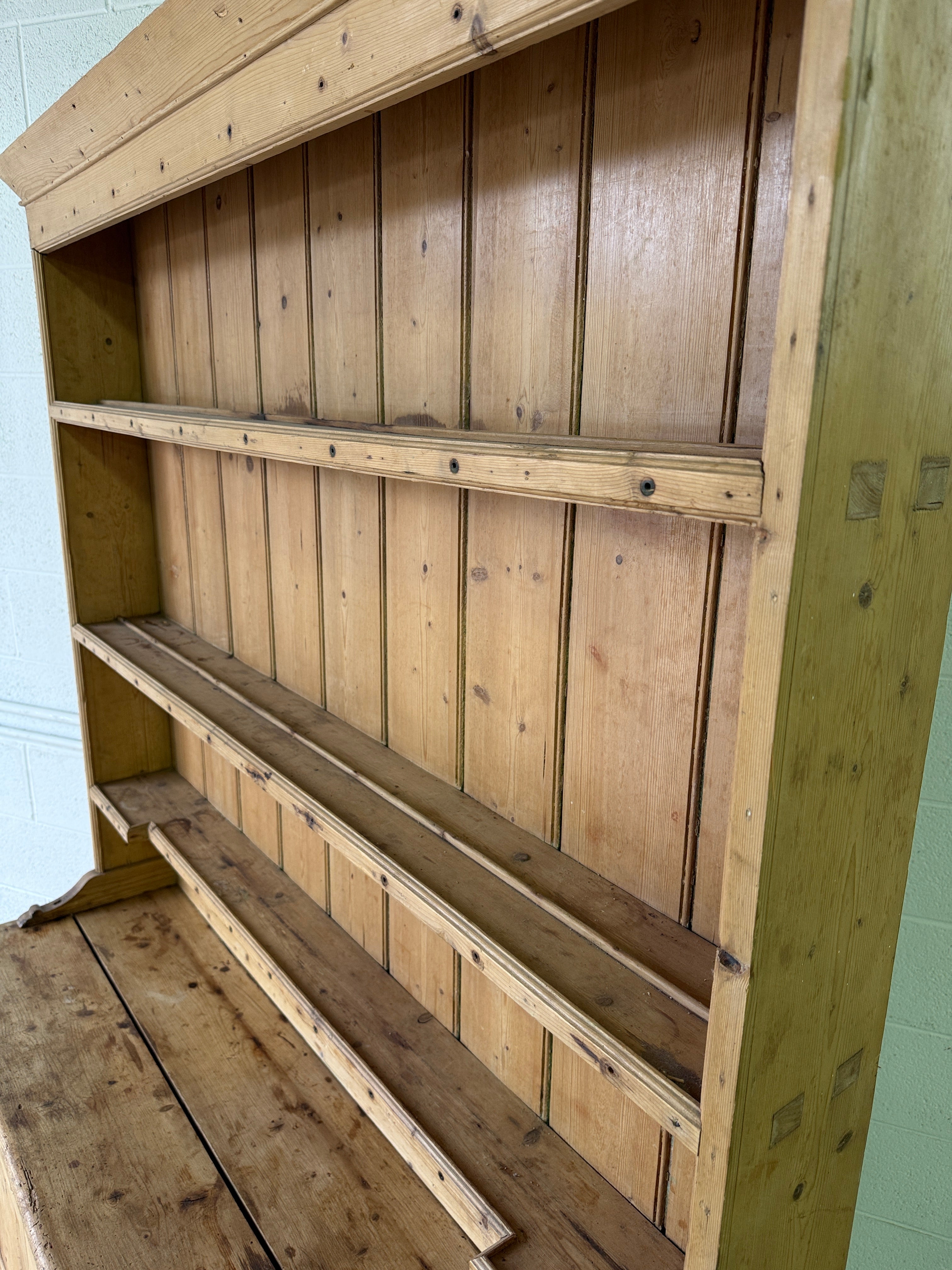 Striking antique pine kitchen dresser with brass pulls