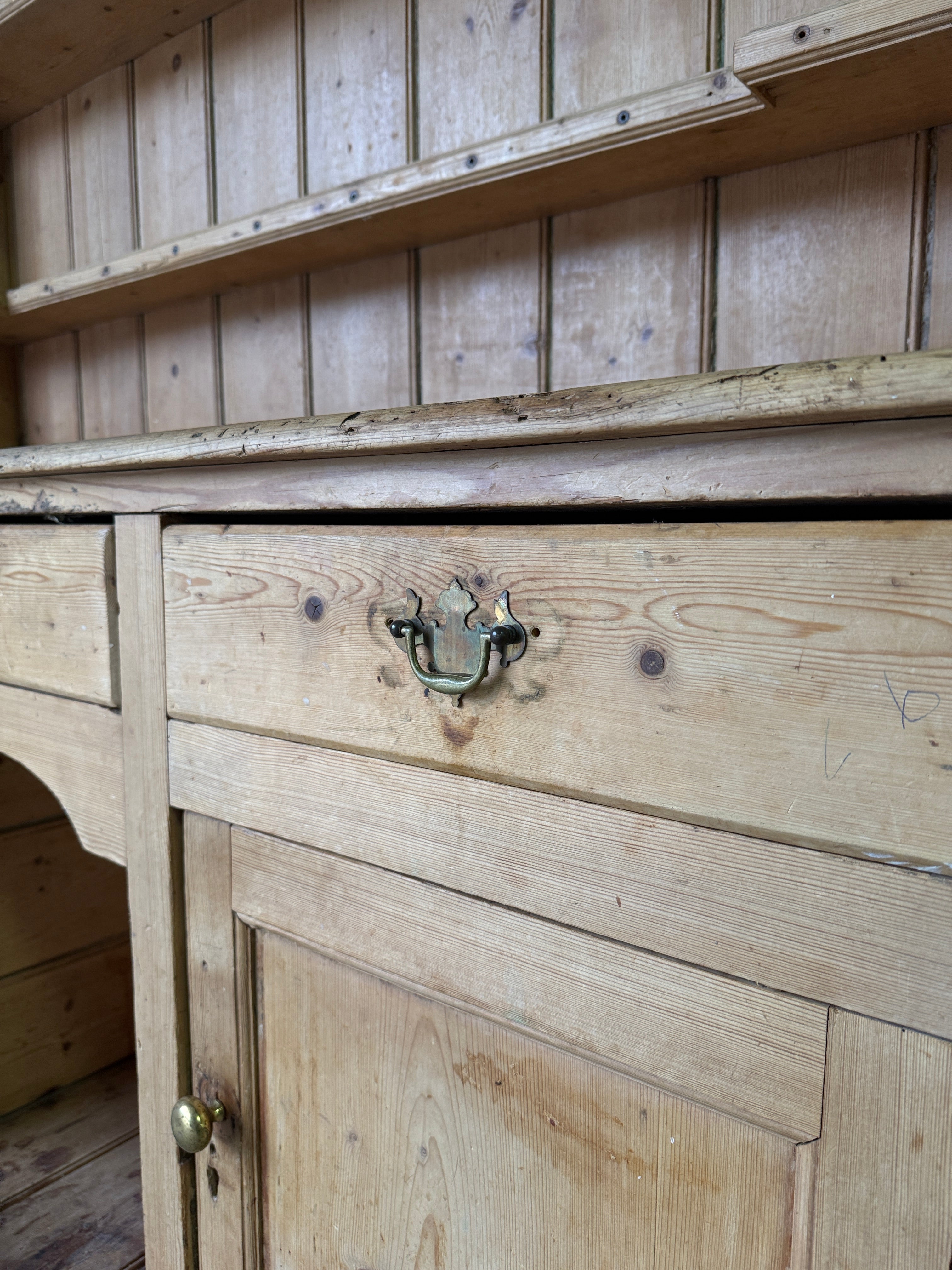 Striking antique pine kitchen dresser with brass pulls