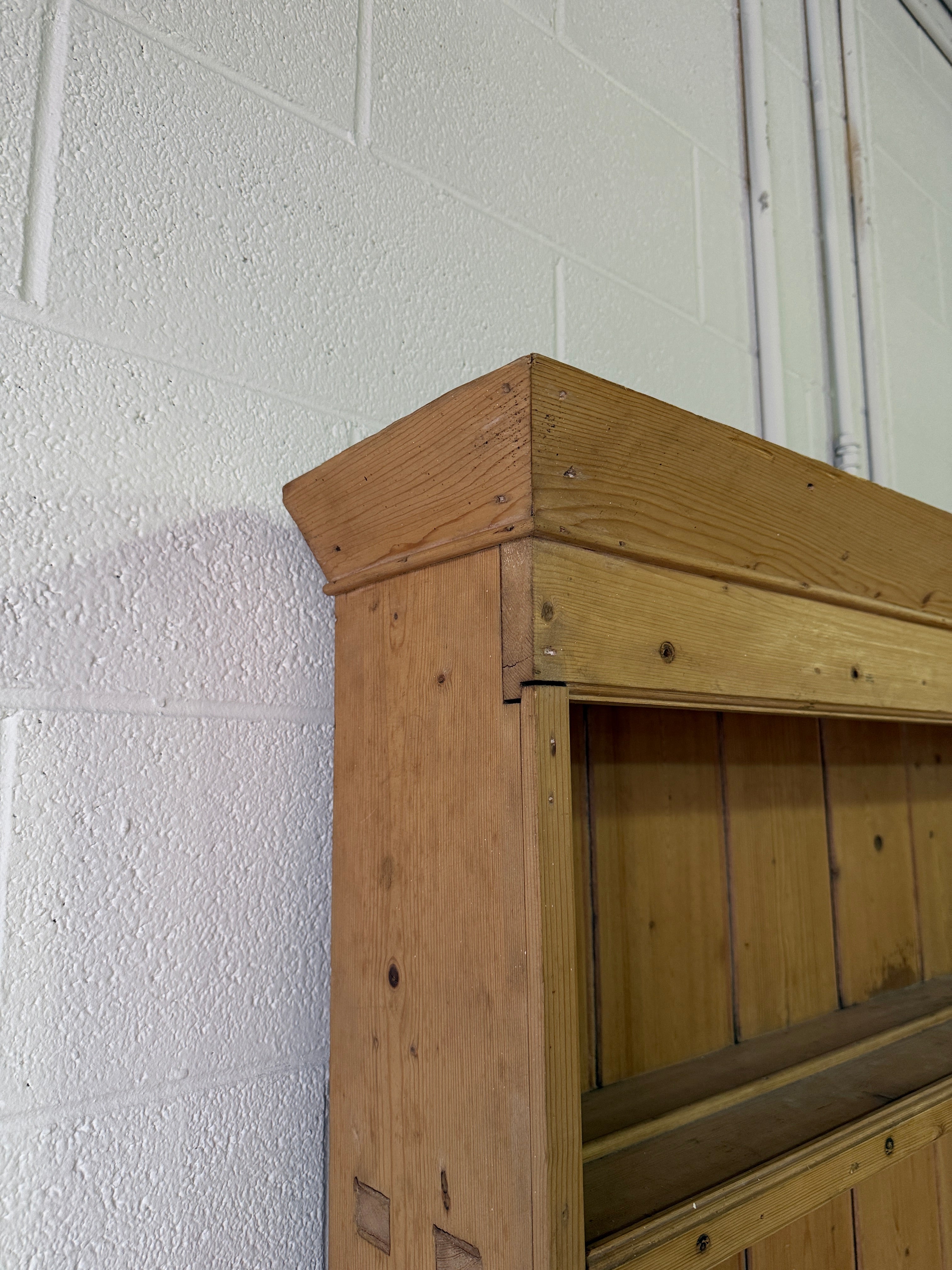 Striking antique pine kitchen dresser with brass pulls