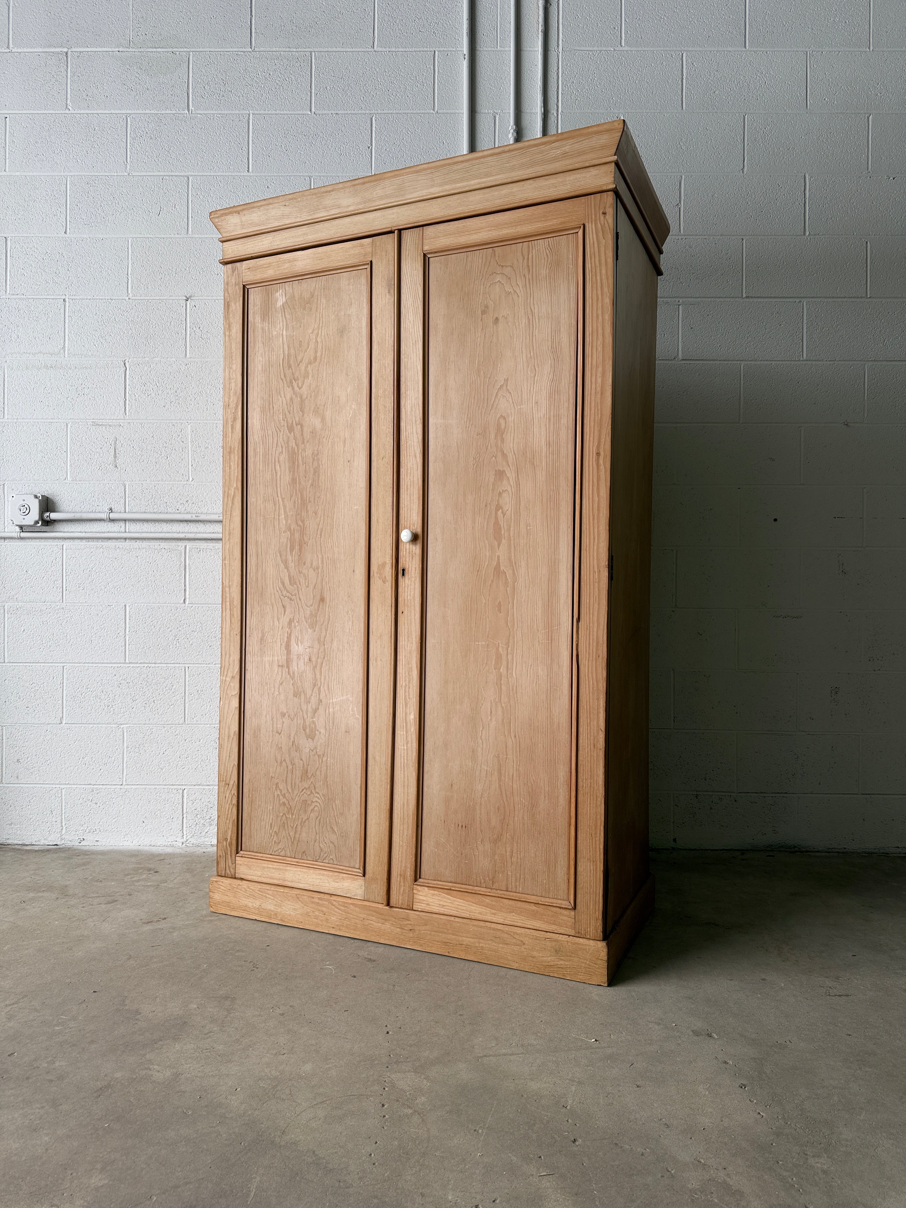 Modest antique English pine wardrobe