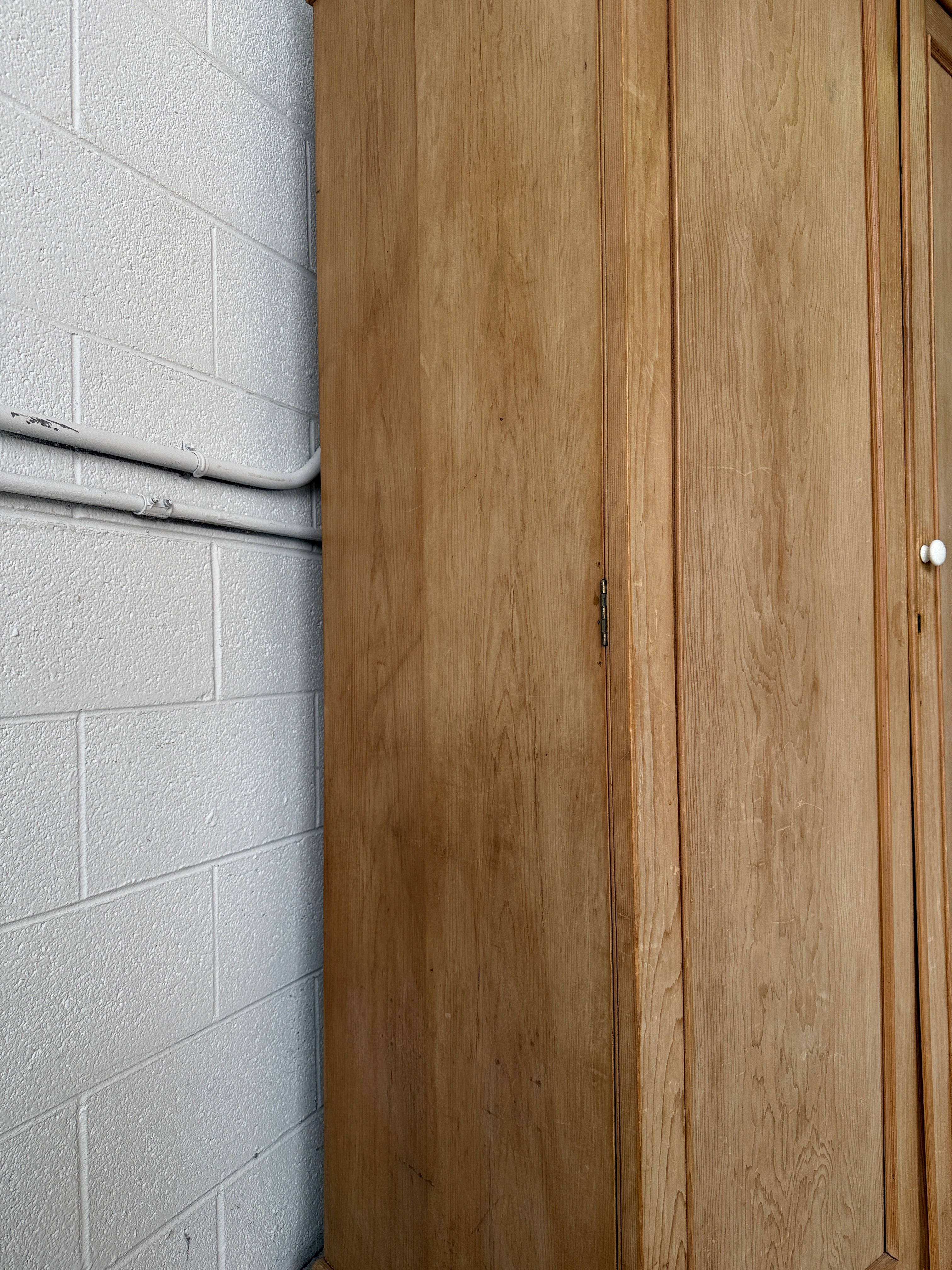 Modest antique English pine wardrobe
