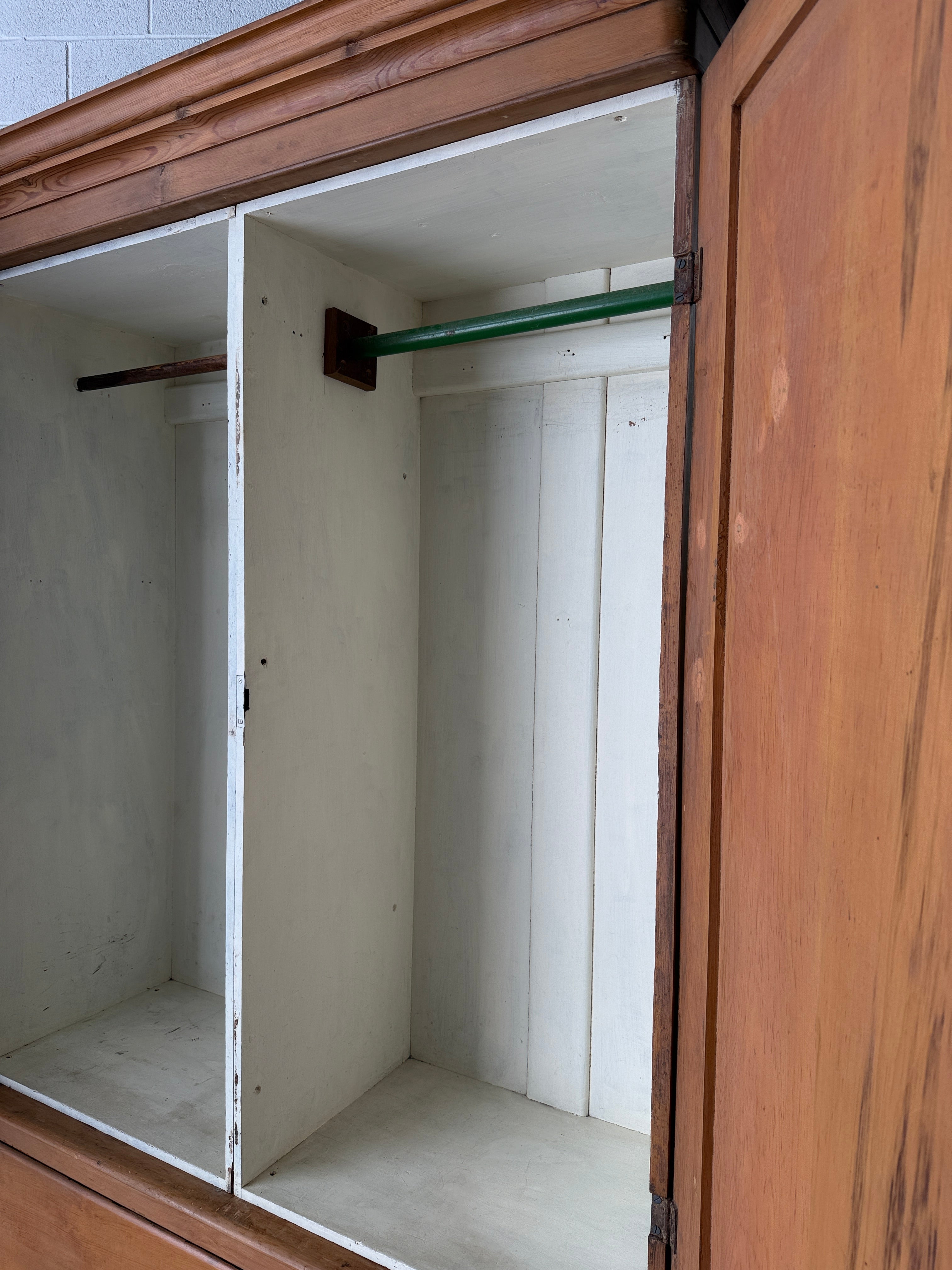 Substantial antique pine double wardrobe with painted interior