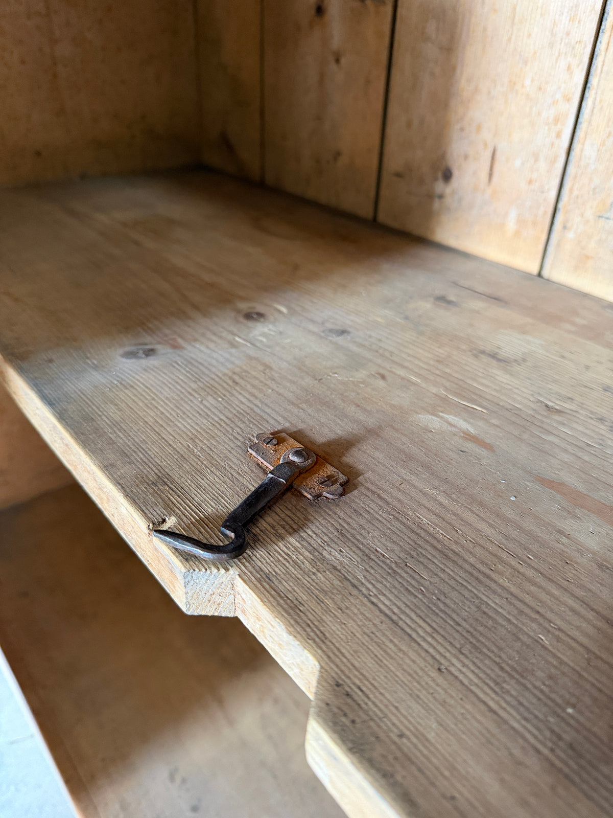 Antique European pine cupboard with hidden upper drawer