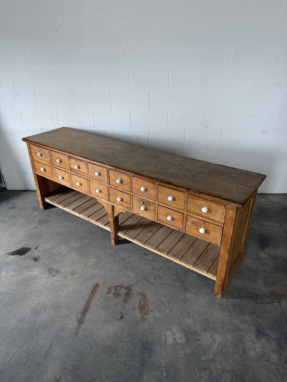 English antique pine shop counter with 15 drawers